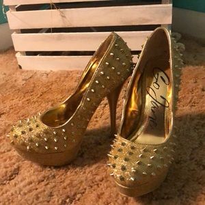 Gold spiked pumps